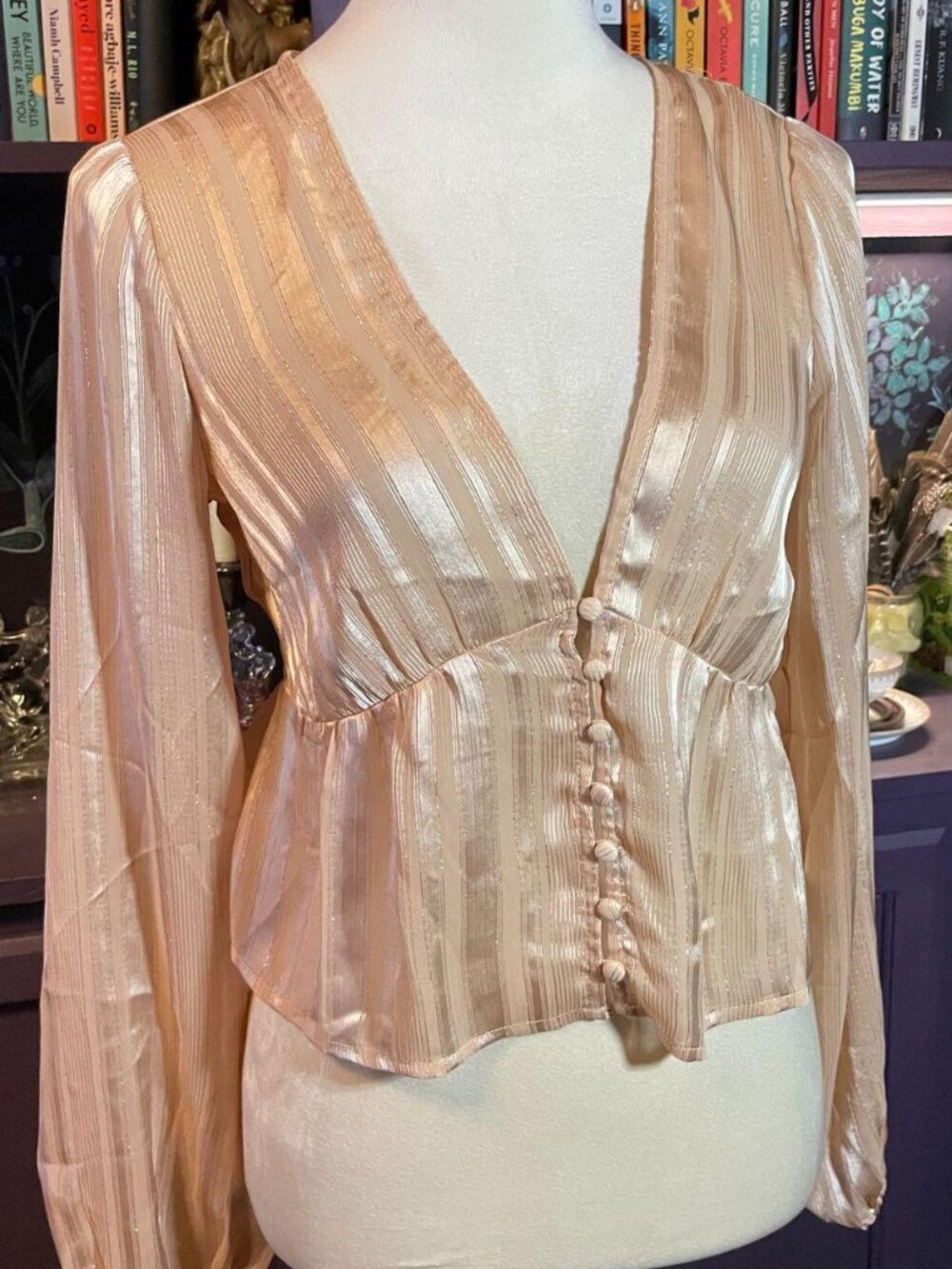 Romantic pink satin blouse with long sleeves